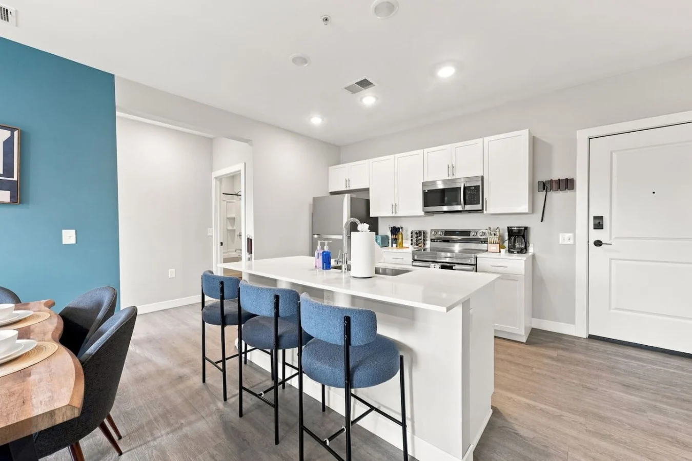 Modern kitchen with blue island stools