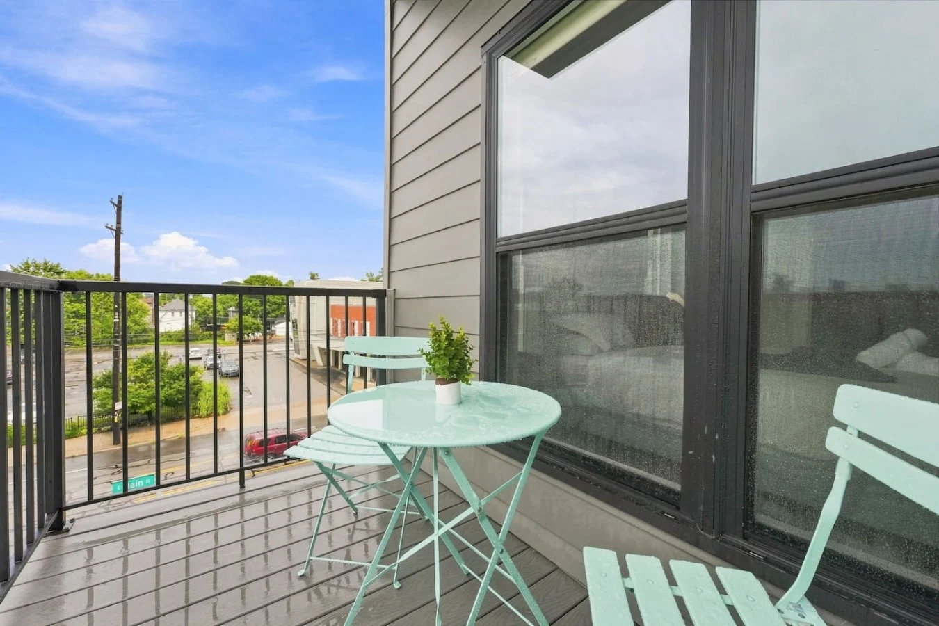 Balcony with teal bistro set