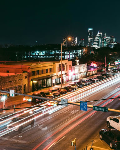 Busy Austin city street at night with traffic and lights