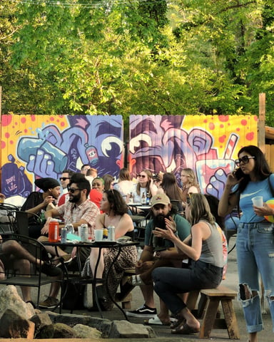 People dining outdoors at a park restaurant in Atlanta