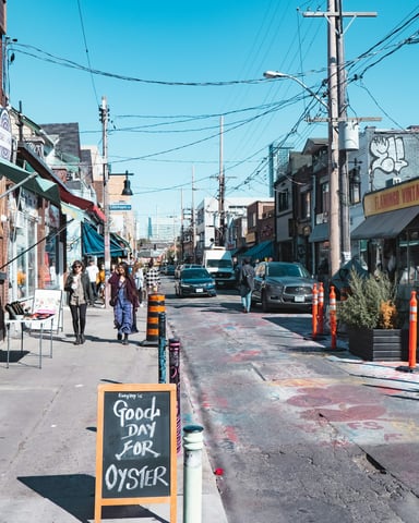 Toronto city street with pedestrians and tall buildings