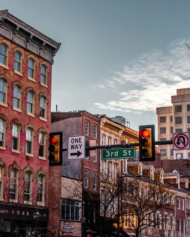 Philadelphia city street with tall buildings and pedestrians