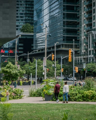 People walking through a lush green park in Ontario